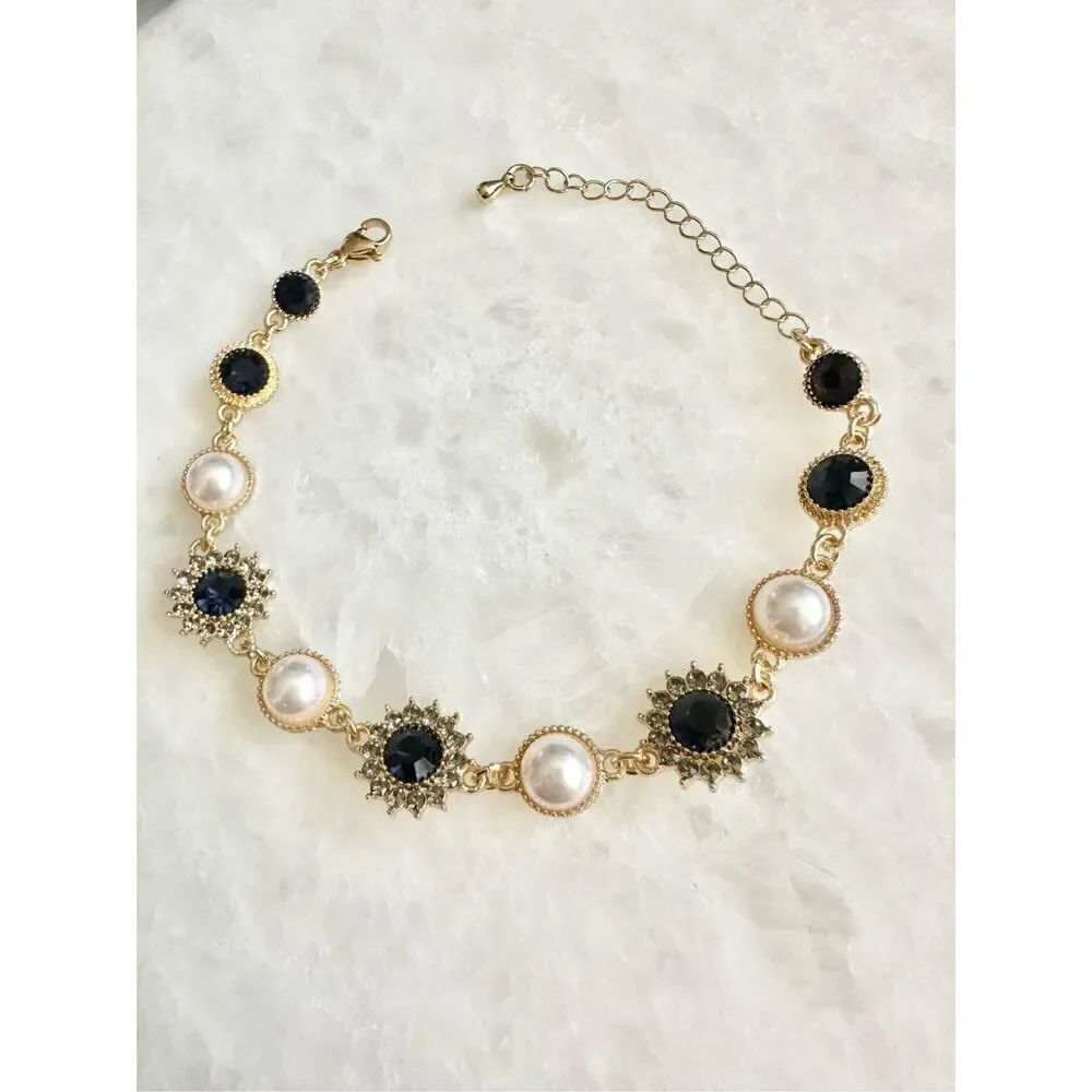 Dark blue sapphire rhinestone with gold chain-link with pearl regal style bracel